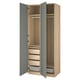 An open light brown PAX wardrobe with blue doors, featuring shelves, drawers, and a clothes rail.