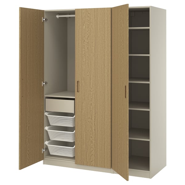 PAX wardrobe with oak doors, white shelves, and mesh drawers.