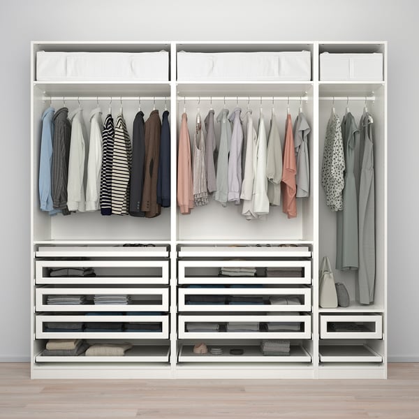 Organised wardrobe hanging clothes, drawers with glass fronts, and storage bins, offering visible and efficient storage.