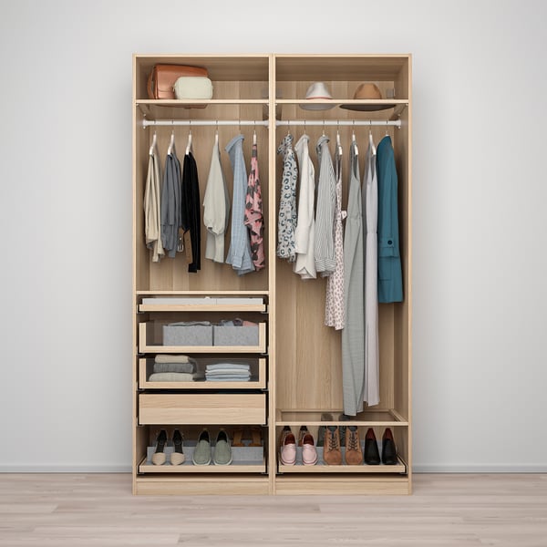 Modern PAX wardrobe with organised clothes, shoes, and accessories.