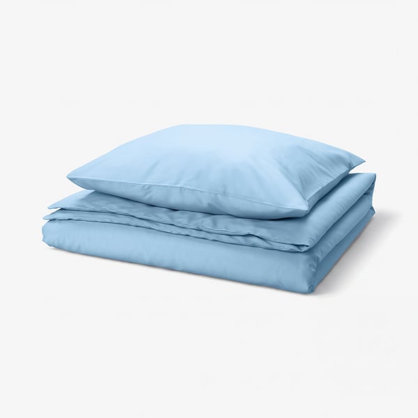 Sky-blue duvet set, folded, smooth fabric, rectangular shape, button closure.