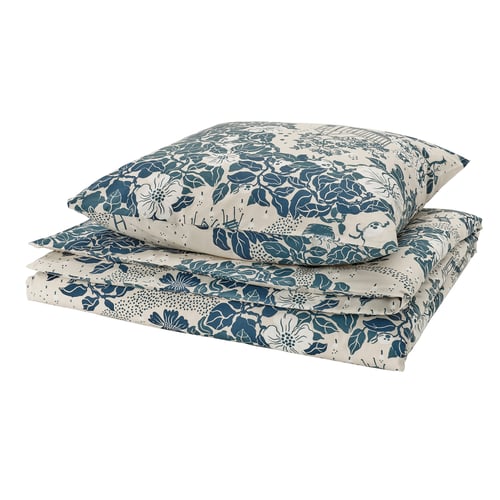 Folded floral bedding set, teal and white. Recycled cotton and lyocell. Elegant floral print.