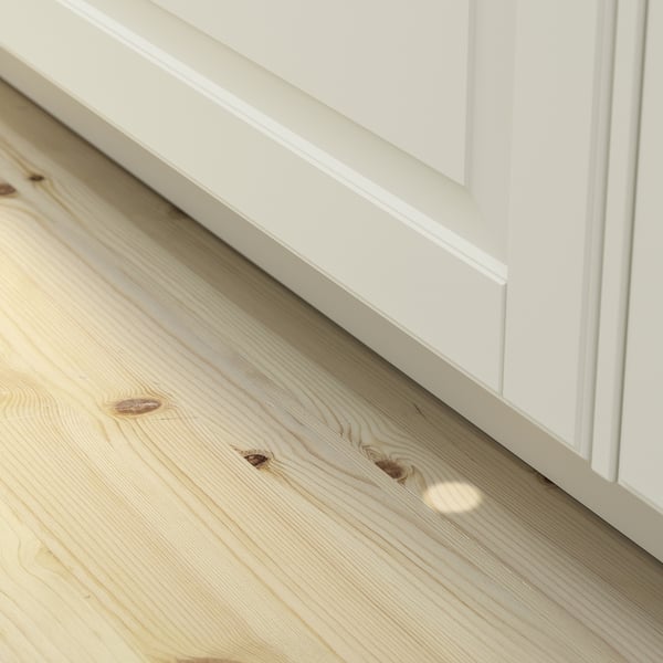 A built-in dishwasher with a light shining on the floor. This is the beam on floor function, highlighting when the dishwasher operates.