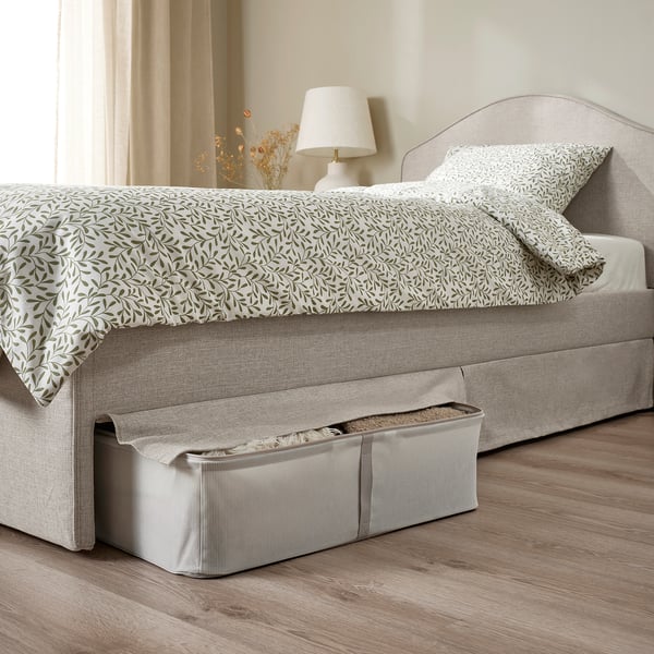 Upholstered bed with headboard, removable cover, under-bed storage.