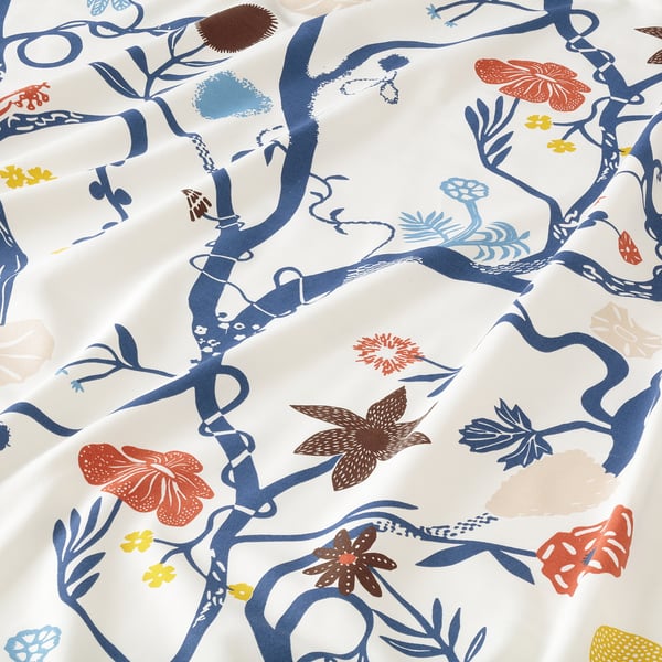 Bright, vibrant floral print fabric with intricate blue branches and colourful flowers, showcasing high-quality, detailed design.