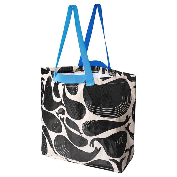 Blue and white recycled bag with whale design.