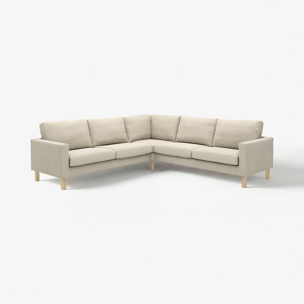 A beige SALTSJÖBADEN sectional sofa with wooden legs. It looks modern and comfortable, designed for a cosy living space.