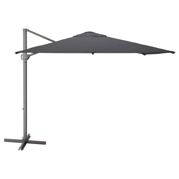 A grey SEGLARÖ parasol with a square shape and a metal stand. It a fabric canopy and a wind vent.