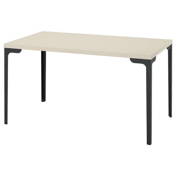The SKÅLSTA table is a beige rectangular desk with black metal legs, featuring a minimalist design.
