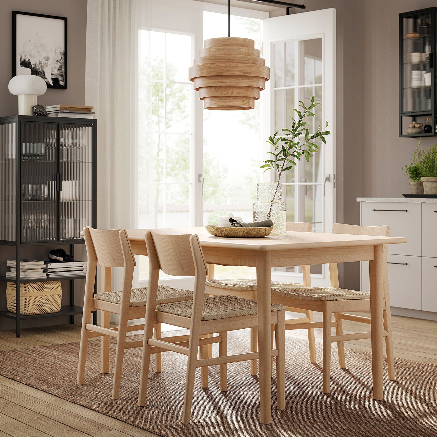 Minimalist dining set with light wooden table and matching chairs, accented by a pendant lamp and potted plant on a wooden floor.