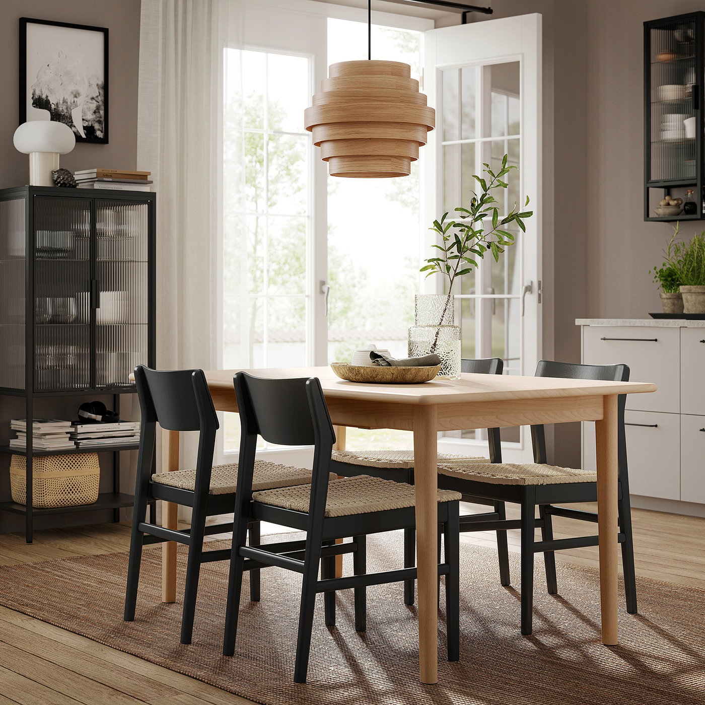 Modern dining area with SKANSNÄS table and chairs, light wood and black, minimalist design, natural light.