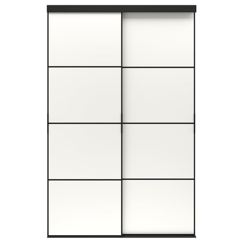 A SKYTTA sliding door in black with frosted glass panels. The modern design an anodized aluminum frame and pine support rails.