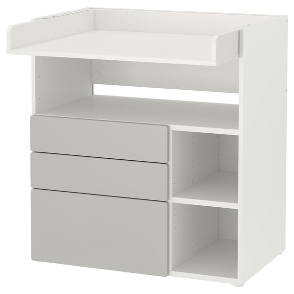 White SMÅSTAD baby changer unit with open and drawer storage.