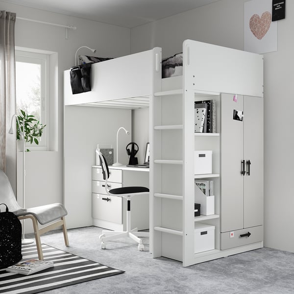Modern white kids loft bed setup with desk, storage, and stairs. Bright, organised room with minimalist decor.