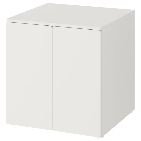 A white cube-shaped storage cabinet by IKEA. It has two doors with soft-close hinges and adjustable feet for stability on uneven surfaces.