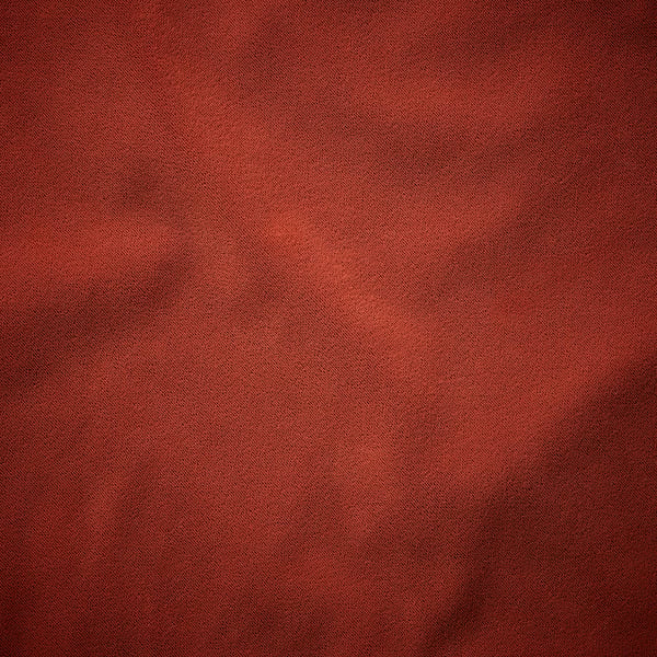 Rich, red-brown fabric close-up with subtle texture, showcasing high-quality, luxurious feel.