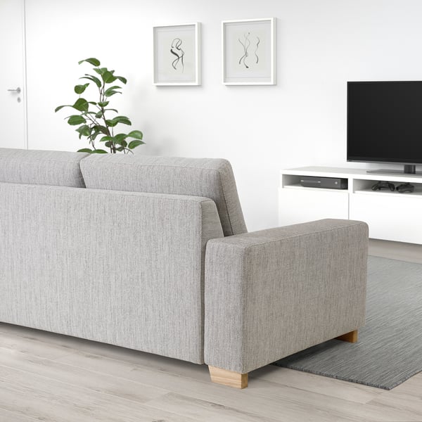 SÖRVALLEN light grey sofa, modern, minimalist; seated prominently in room, fits well with tv stand & decor.