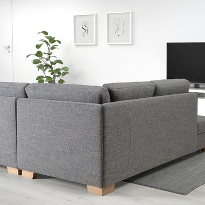 Modern living room with SÖRVALLEN sofa, plant, tv, and artwork.