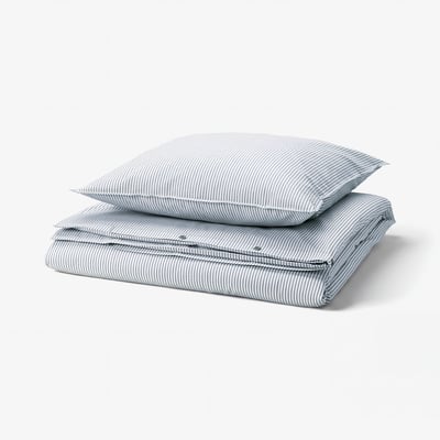 A SOLFIBBLA duvet cover set in blue and white stripes, made from soft cotton.