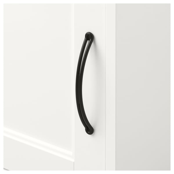 Black curved handle on white cabinet door, smooth surface.