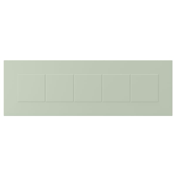 A green rectangular panel with grooved dividers, representing a STENSUND front made of fibreboard and paint.