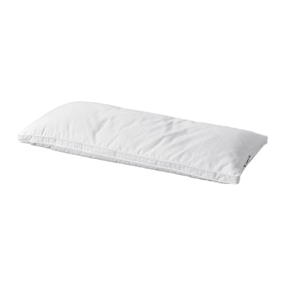 A white strandmolne pillow, rectangular, with soft fabric and double piping for comfort.