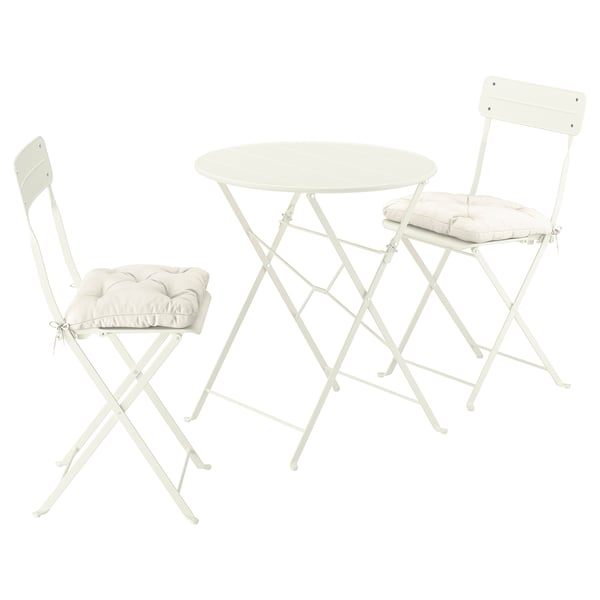 White outdoor set, includes table and cushioned chairs, folds away.