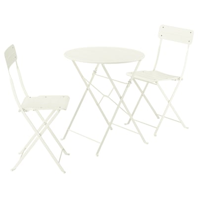 White metallic bistro set with round table and two folding chairs.