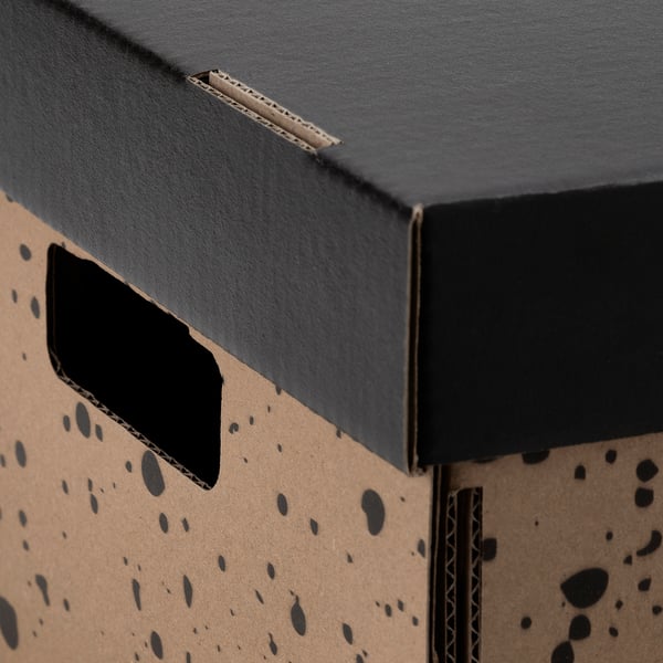 Box corner made of sturdy recycled cardboard with handle cutout.