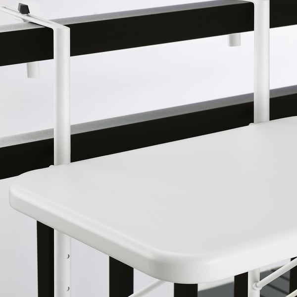 Foldable outdoor table with black and white design, sturdy metal frame, smooth surfaces.