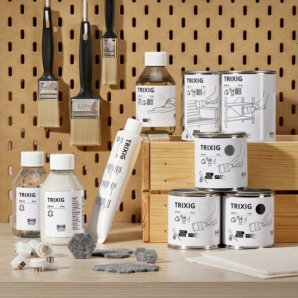 Various sizes of TRIXIG leather conditioner bottles and cans displayed with brushes, wood pieces, and application tools on a pegboard.