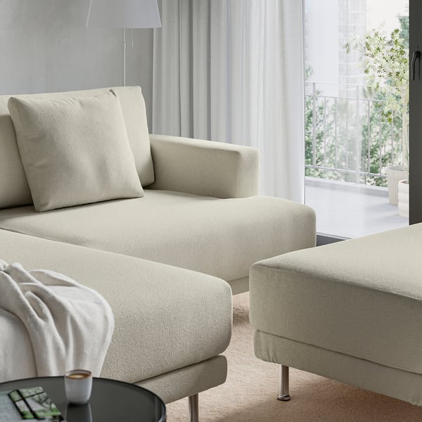 Light beige UPPÅKRA sofa, cosy and stylish, with oversized cushions and sink-in comfort, perfect for family relaxation.
