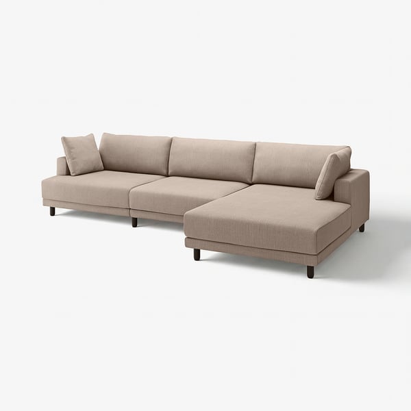 An UPPÅKRA sectional sofa in beige. It has a modern design with deep cushions and dark wooden legs.