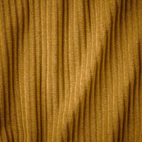 Golden textured corduroy fabric close-up, showcasing deep wale and soft touch.