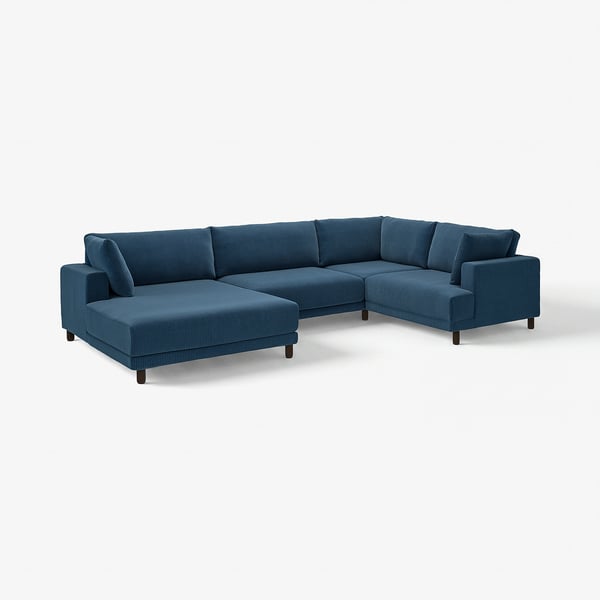 Teal sectional sofa with sink-in cushions and wooden legs, ideal for family relaxation.