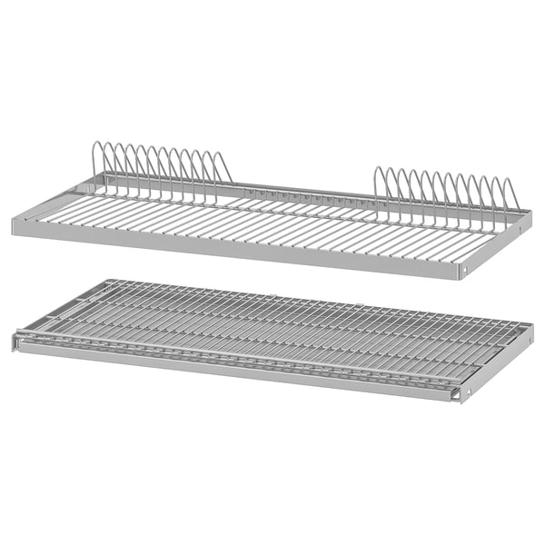 Two silver UTRUSTA metal dish drainers, one with cup holders, stacked neatly.