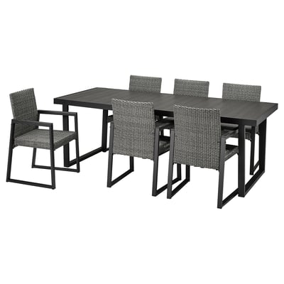 VÄRMANSÖ outdoor dining set: black, 6 wicker chairs, steel table, modern, durable.