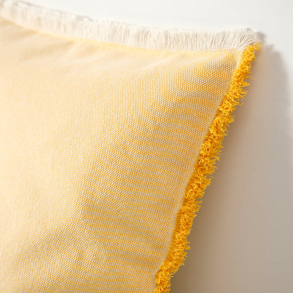 Yellow and white fringed textile, showcasing intricate weaving and soft fabric quality.