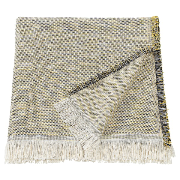 The VÄXELBRUK throw blanket is light brown and light grey with colourful fringes, rectangular shaped, made from recycled work clothes.