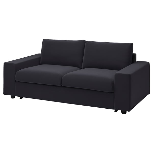Modern black sofa-bed, minimalist design, velvet fabric, comfortable cushions.