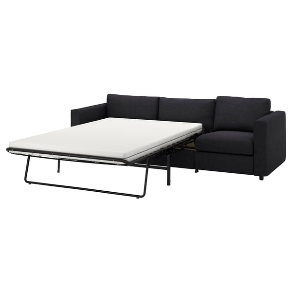 Black VIMLE sofa bed; modern, l-shaped, fabric-covered, with pull-out mattress.