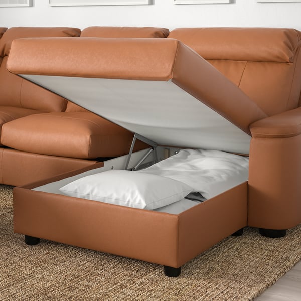 Sofa with storage: lifted seat reveals hidden compartment.