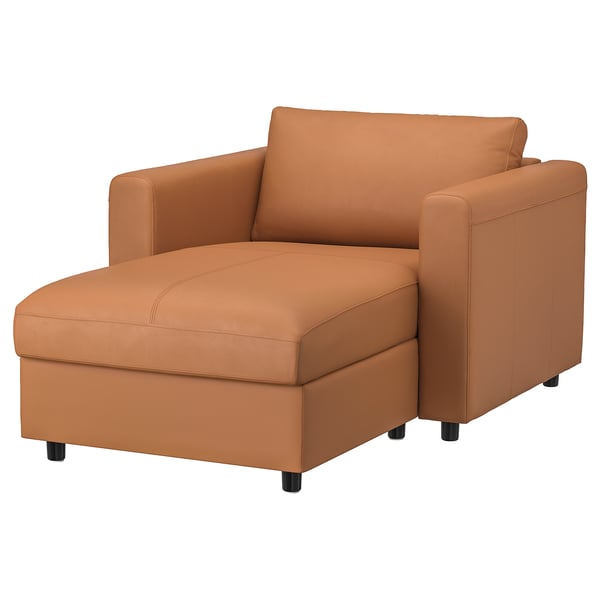Orange sofa chair, VIMLE, with storage footrest, leather upholstery, modern design.