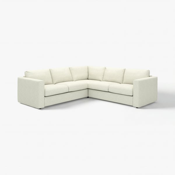 A VIMLE sectional sofa in white tweed. It has a modern, boxy design with a comfortable, low-profile. Ideal for contemporary living rooms.