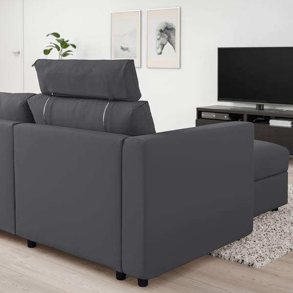 Grey VIMLE sectional sofa in minimalist living room with tv and art.