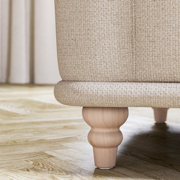 Cream wood leg of VISKAFORS sofa, classic, curved, sturdy.