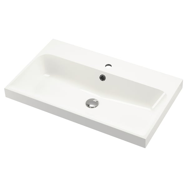 En hvid bagvask med moderne design, rektangulær form og glatte kanter, velegnet til moderne badeværelser.