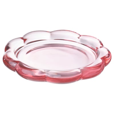 Et lyserødt, glas, blomsterformet BLADFÅGEL lysfad. Moderne og dekorativ, den er designet til at holde bloklys.