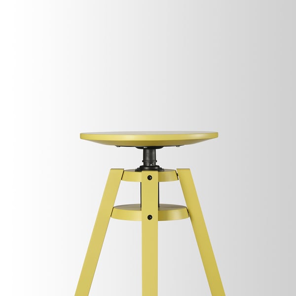 Gul højdejusterbar skammel med rundt sæde, robuste metalben, kvalitetsdesign.