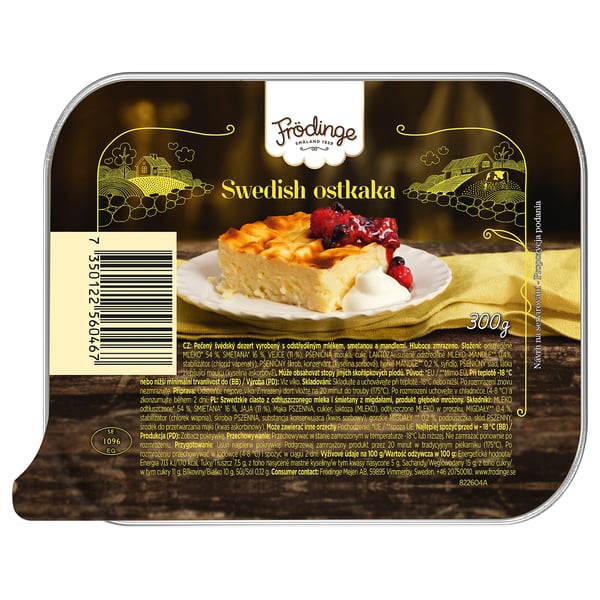 FRÖDINGE svensk cheesecake emballage. Viser en skive cheesecake med bær på et gult klæde.